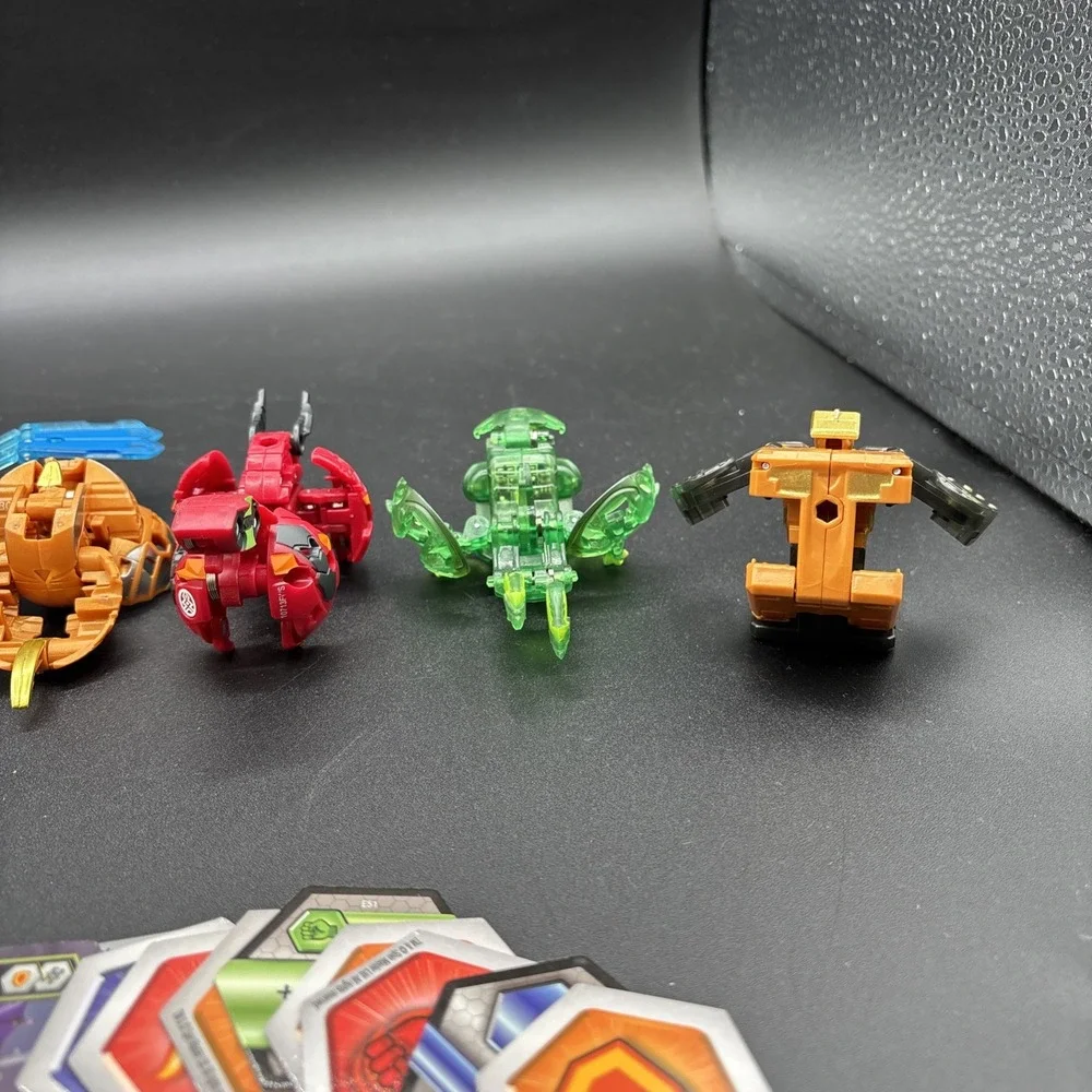 Lot Of 9 Bakugan Figures And 23 Bakugan Cards/Metal Card